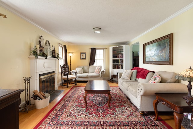 41 Northridge Ave, Torrington, CT 06790 - living room featuring crown molding, wood finished floors, and a fireplace with flush hearth