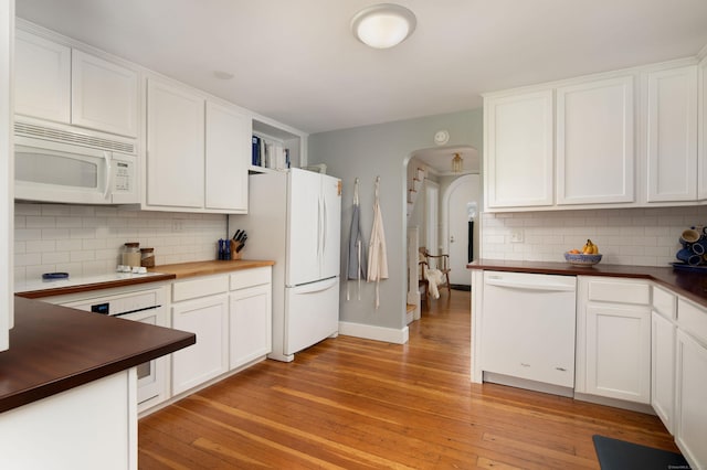 41 Northridge Ave, Torrington, CT 06790 - kitchen with white appliances, butcher block countertops, backsplash, arched walkways, and light wood-style flooring