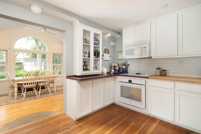 41 Northridge Ave, Torrington, CT 06790 - kitchen with white appliances, light wood finished floors, white cabinets, glass insert cabinets, and decorative backsplash
