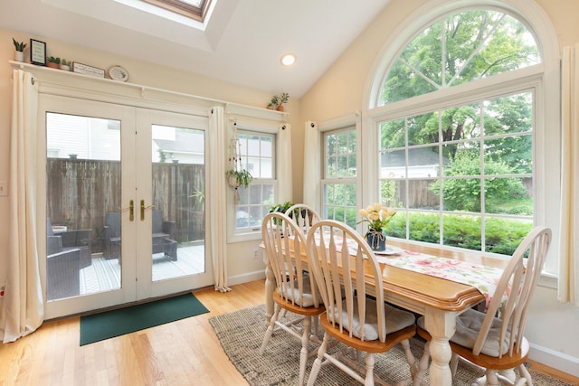 41 Northridge Ave, Torrington, CT 06790 - dining room featuring light wood-style flooring, lofted ceiling, a skylight, french doors, and recessed lighting