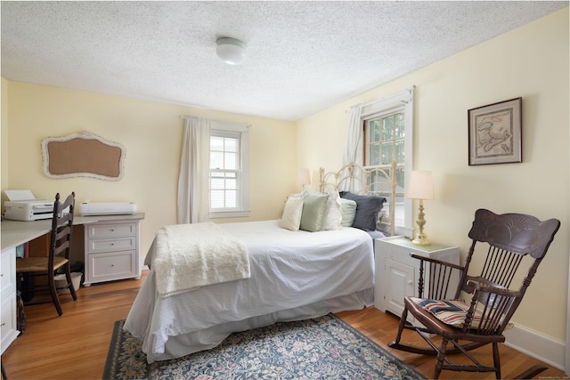 41 Northridge Ave, Torrington, CT 06790 - bedroom featuring a textured ceiling, light wood-style floors, and a desk