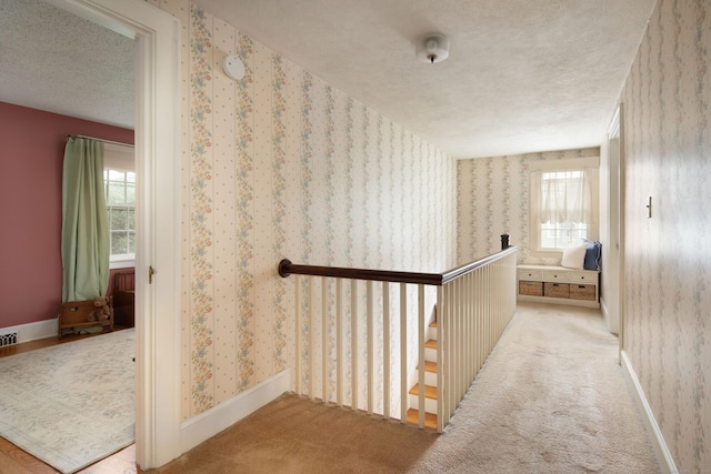 41 Northridge Ave, Torrington, CT 06790 - hallway with an upstairs landing, wallpapered walls, a textured ceiling, and carpet floors