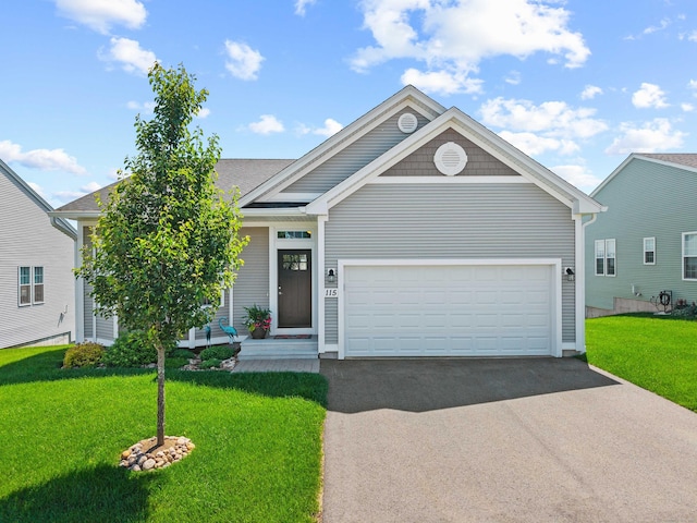 115 Webster Ln Unit 115, Middletown, CT 06457 - view of front of property featuring driveway, a front lawn, and a garage