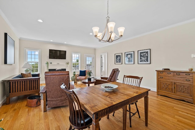 115 Webster Ln Unit 115, Middletown, CT 06457 - dining room featuring light wood-type flooring, crown molding, a chandelier, a fireplace, and recessed lighting