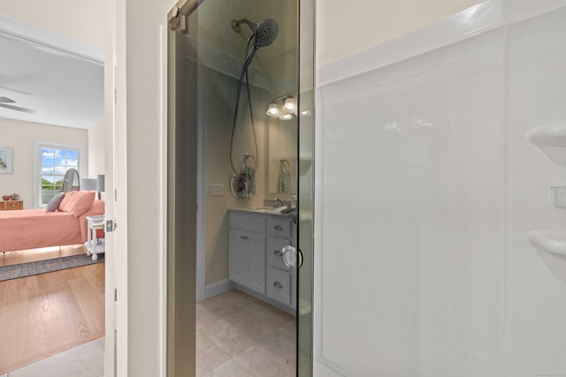 115 Webster Ln Unit 115, Middletown, CT 06457 - ensuite bathroom featuring a walk in shower, vanity, a ceiling fan, and tile patterned floors