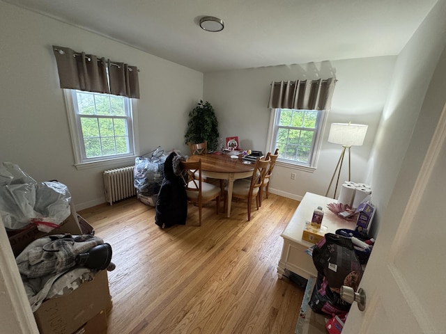 24 N Forest Cir, West Haven, CT 06516 - dining space with radiator heating unit and light wood-type flooring