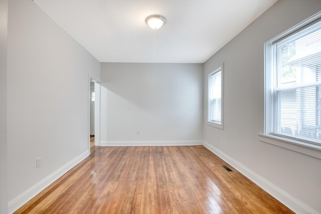 289 E Ave, Bridgeport, CT 06610 - unfurnished room featuring light wood-style floors and baseboards