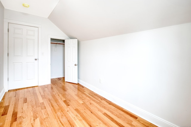 289 E Ave, Bridgeport, CT 06610 - unfurnished bedroom featuring light wood-type flooring, vaulted ceiling, and a closet