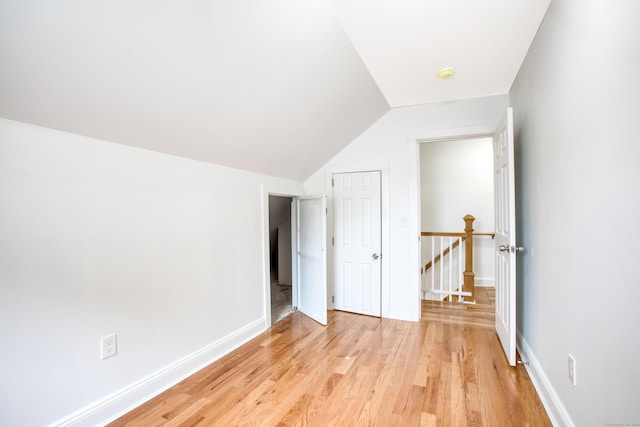 289 E Ave, Bridgeport, CT 06610 - unfurnished bedroom featuring light wood-type flooring and vaulted ceiling