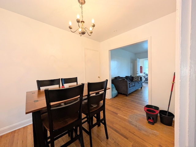 901 William St Apt A, Bridgeport, CT 06608 - dining room featuring a chandelier and light wood-style flooring