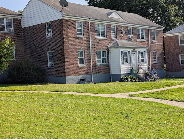 901 William St Apt A, Bridgeport, CT 06608 - view of front facade featuring brick siding and a front lawn
