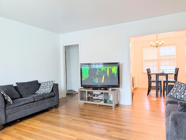 901 William St Apt A, Bridgeport, CT 06608 - living area featuring a chandelier, light wood-type flooring, and radiator