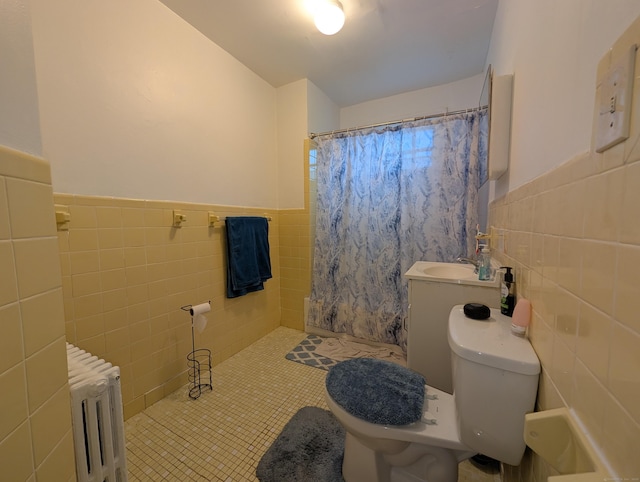 901 William St Apt A, Bridgeport, CT 06608 - full bathroom with radiator heating unit, tile walls, a shower with shower curtain, tile patterned floors, and pet washing area