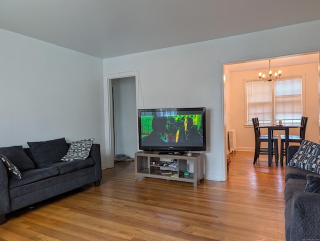 901 William St Apt A, Bridgeport, CT 06608 - living area with radiator, a chandelier, and wood finished floors