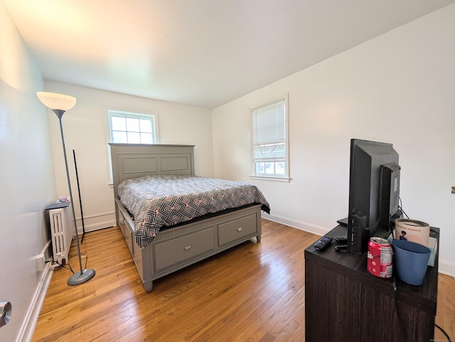 901 William St Apt A, Bridgeport, CT 06608 - bedroom with light wood-style flooring and radiator