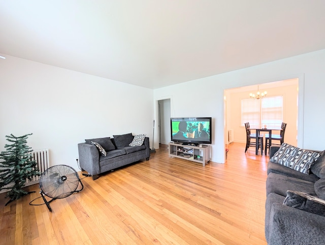901 William St Apt A, Bridgeport, CT 06608 - living room featuring a chandelier, light wood-type flooring, and radiator