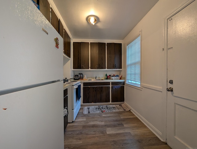 901 William St Apt A, Bridgeport, CT 06608 - kitchen featuring white appliances, dark brown cabinetry, dark wood-style floors, and light countertops