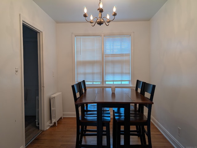 901 William St Apt A, Bridgeport, CT 06608 - dining space featuring radiator heating unit, wood finished floors, and a chandelier