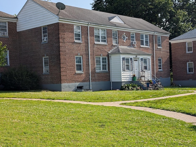 901 William St Apt A, Bridgeport, CT 06608 - view of front of home with a front yard and brick siding