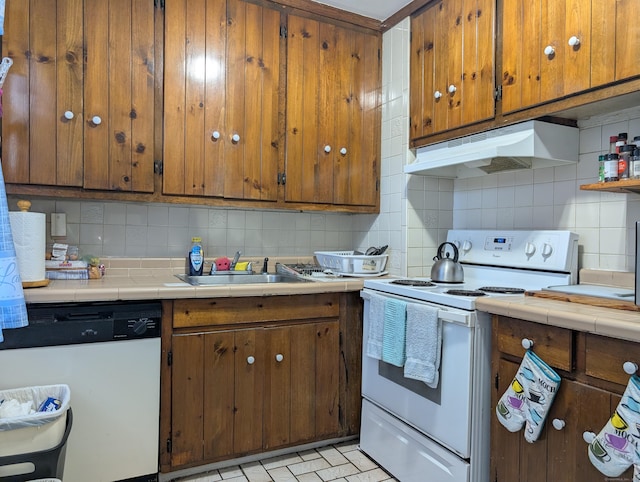 901 William St Apt B, Bridgeport, CT 06608 - kitchen featuring white appliances, under cabinet range hood, tasteful backsplash, and tile countertops
