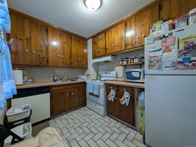 901 William St Apt B, Bridgeport, CT 06608 - kitchen featuring white appliances, tile countertops, under cabinet range hood, and tasteful backsplash