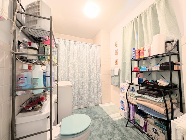 901 William St Apt B, Bridgeport, CT 06608 - full bathroom featuring radiator, a shower with curtain, and tile walls