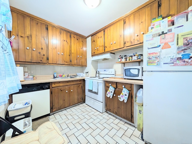 901 William St Apt B, Bridgeport, CT 06608 - kitchen with white appliances, decorative backsplash, under cabinet range hood, and tile countertops