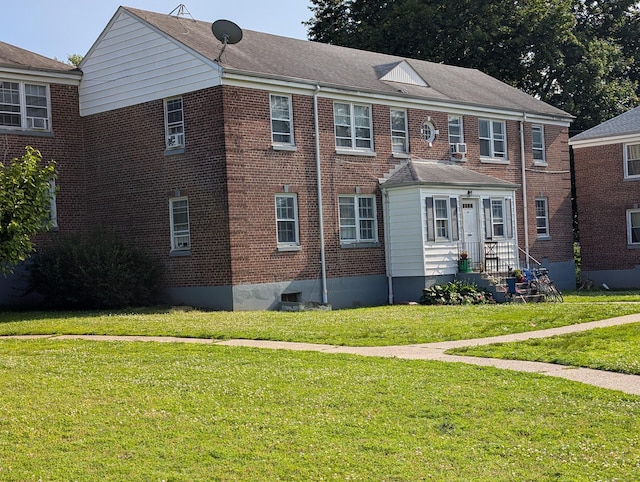 901 William St Apt B, Bridgeport, CT 06608 - view of property exterior with a yard, brick siding, and cooling unit