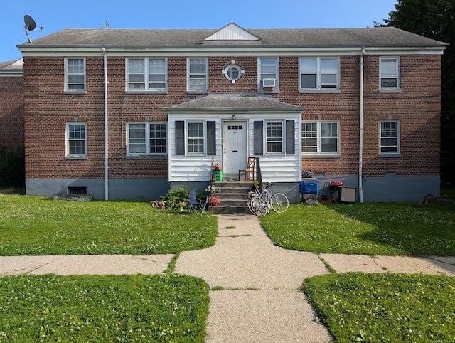 901 William St Apt B, Bridgeport, CT 06608 - view of front of property featuring brick siding, a front yard, and roof with shingles