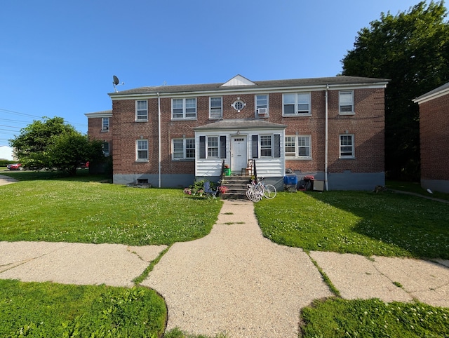 901 William St Apt C, Bridgeport, CT 06608 - view of property featuring brick siding and a front lawn