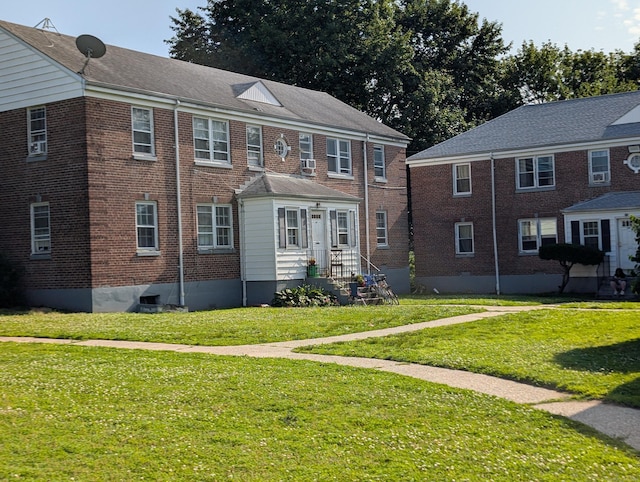 901 William St Apt C, Bridgeport, CT 06608 - view of front of property featuring a front lawn and brick siding