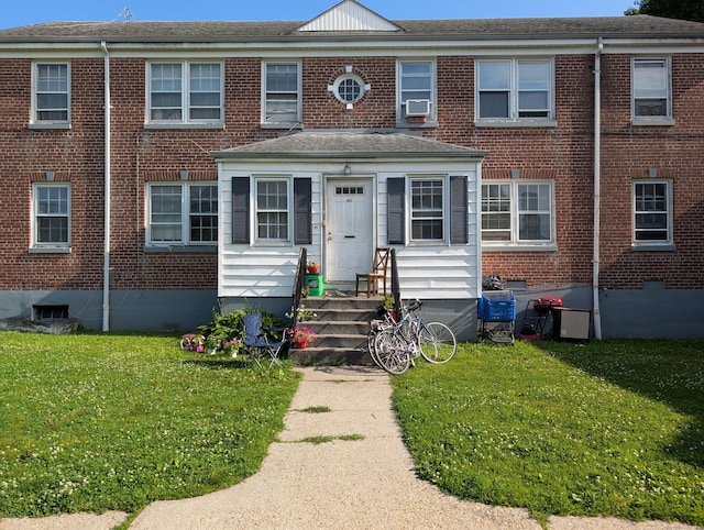 901 William St Apt C, Bridgeport, CT 06608 - view of front of property with brick siding, a front yard, cooling unit, and crawl space