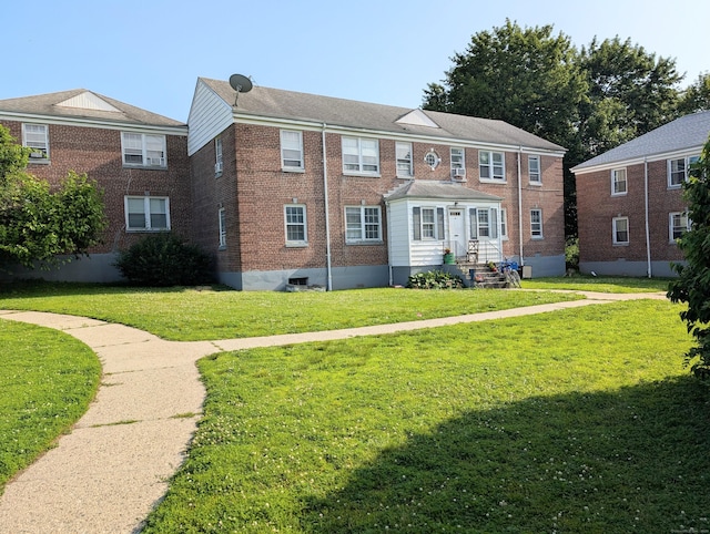 901 William St Apt C, Bridgeport, CT 06608 - townhome / multi-family property with brick siding and a front lawn