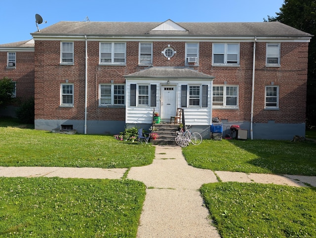 901 William St Apt D, Bridgeport, CT 06608 - view of front facade featuring a front lawn and brick siding