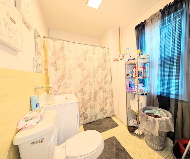 901 William St Apt D, Bridgeport, CT 06608 - full bath featuring a shower with shower curtain, tile walls, and tile patterned floors