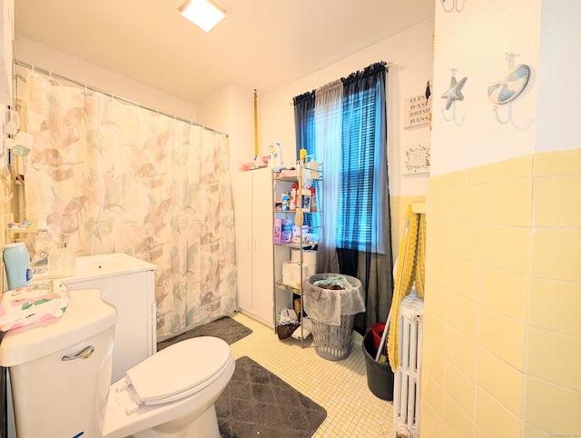 901 William St Apt D, Bridgeport, CT 06608 - full bathroom with wainscoting, tile walls, a shower with curtain, and radiator