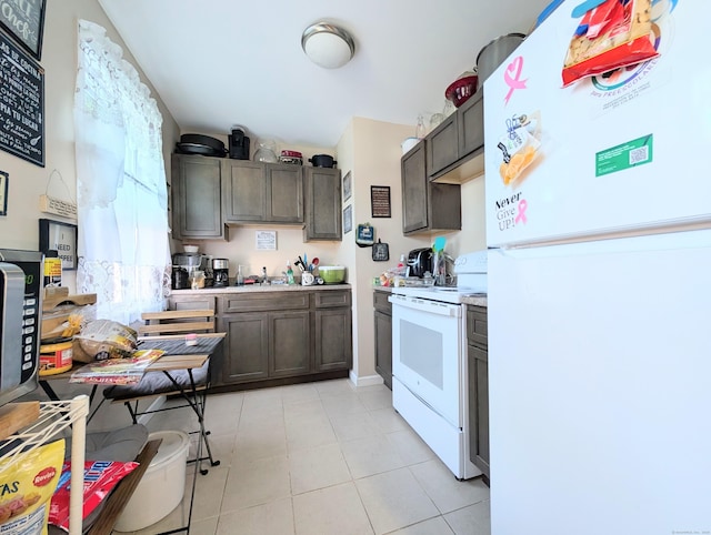 901 William St Apt D, Bridgeport, CT 06608 - kitchen with white appliances, light countertops, dark brown cabinets, and light tile patterned floors