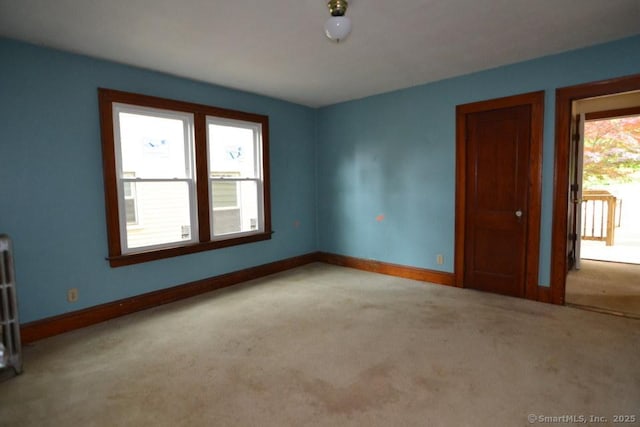 484 W St, Bristol, CT 06010 - spare room with carpet floors and radiator heating unit