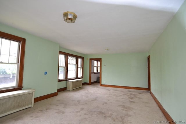 484 W St, Bristol, CT 06010 - unfurnished room featuring radiator heating unit and carpet flooring