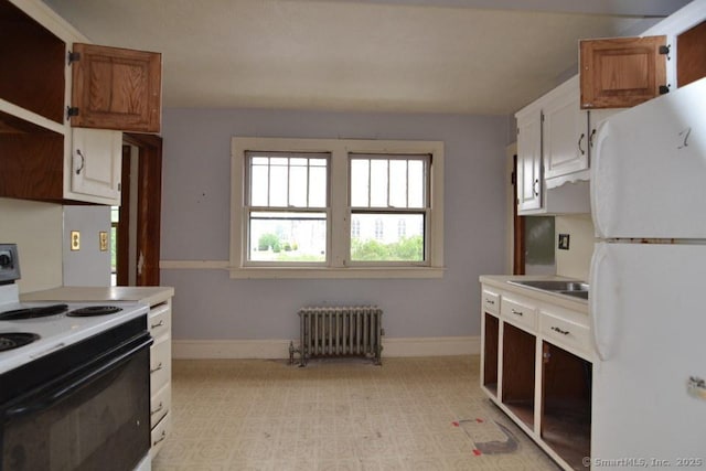 484 W St, Bristol, CT 06010 - kitchen featuring freestanding refrigerator, range with electric cooktop, radiator, and light countertops