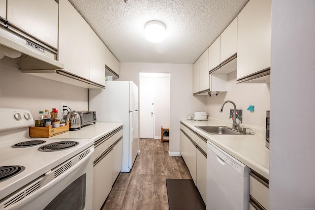 14 Newtown Rd Unit B9, Danbury, CT 06810 - kitchen featuring white appliances, light wood-style floors, white cabinets, light countertops, and a textured ceiling