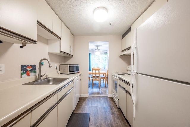 14 Newtown Rd Unit B9, Danbury, CT 06810 - kitchen featuring white appliances, light countertops, dark wood-type flooring, white cabinetry, and a textured ceiling