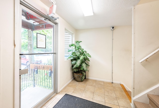 14 Newtown Rd Unit B9, Danbury, CT 06810 - entryway with tile patterned floors and a textured ceiling