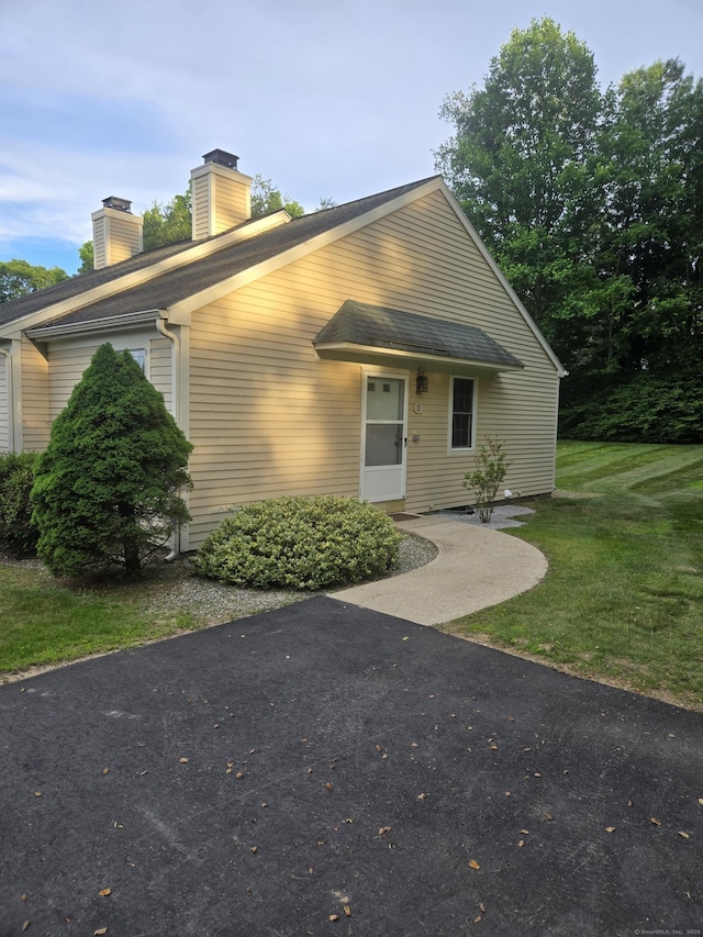 1 Cornfield Pt Unit 1, Woodstock, CT 06281 - view of front of house featuring a chimney and a front yard