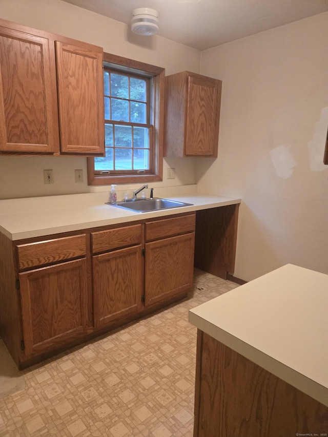 1 Cornfield Pt Unit 1, Woodstock, CT 06281 - kitchen with light flooring, light countertops, and brown cabinetry