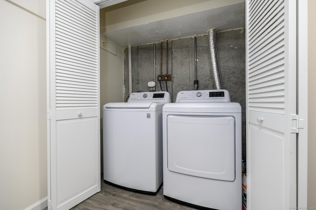 51 Old Kings Hwy Unit 5, Greenwich, CT 06897 - laundry room with wood finished floors and washing machine and dryer