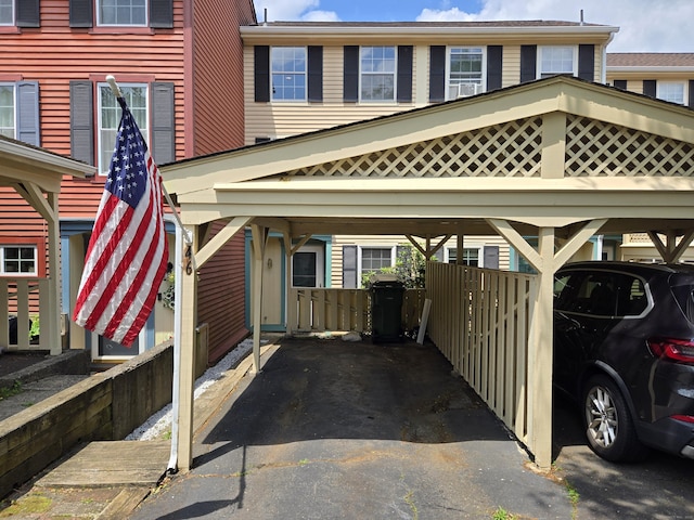46 Rising Trail Dr Unit 46, Middletown, CT 06457 - view of car parking with a carport and asphalt driveway