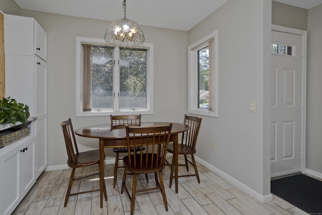 94 The Laurels Unit 94, Enfield, CT 06082 - dining area with light wood-style floors and a chandelier