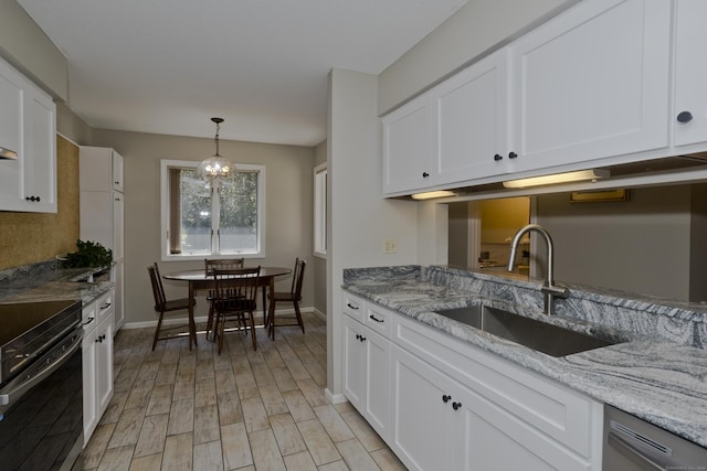 94 The Laurels Unit 94, Enfield, CT 06082 - kitchen with black / electric stove, dishwasher, light wood-style flooring, white cabinets, and light stone countertops