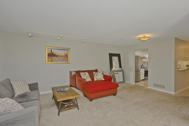 94 The Laurels Unit 94, Enfield, CT 06082 - living room featuring light colored carpet and baseboards